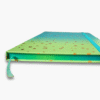Close-up of gold foil notes and ideas lettering on turquoise green ombre notebook