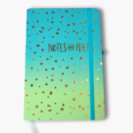 Turquoise to green ombre hardcover notebook with gold foil notes and ideas text