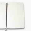 Open grey A5 notebook displaying interior pages