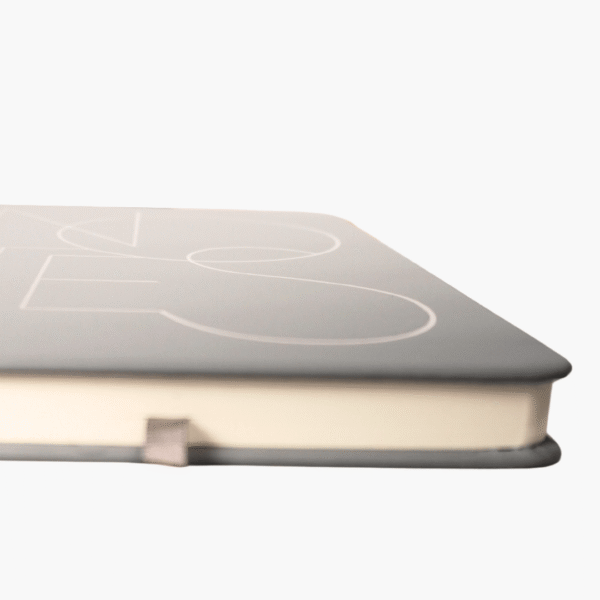Side angle view of grey A5 hardcover notebook