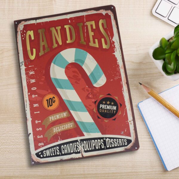 Candy Vintage Journal open on a desk with a pen resting on top, showcasing the vibrant retro candy cane design and lined pages in a creative workspace.