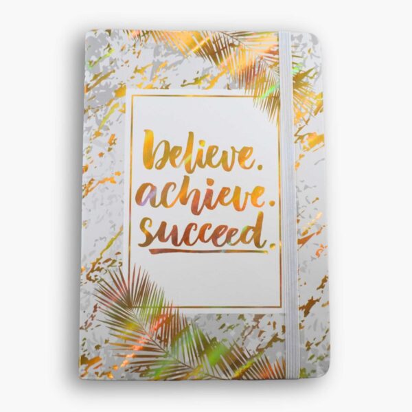 A5 hardcover white notebook with gold text: “Believe, Achieve, Succeed.”