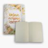 Inside pages of the white and gold notebook showing lined paper.
