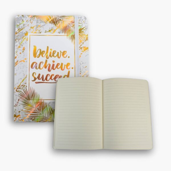 Inside pages of the white and gold notebook showing lined paper.