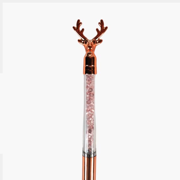 Close-up of the chrome deer head on top of the crystal pen.