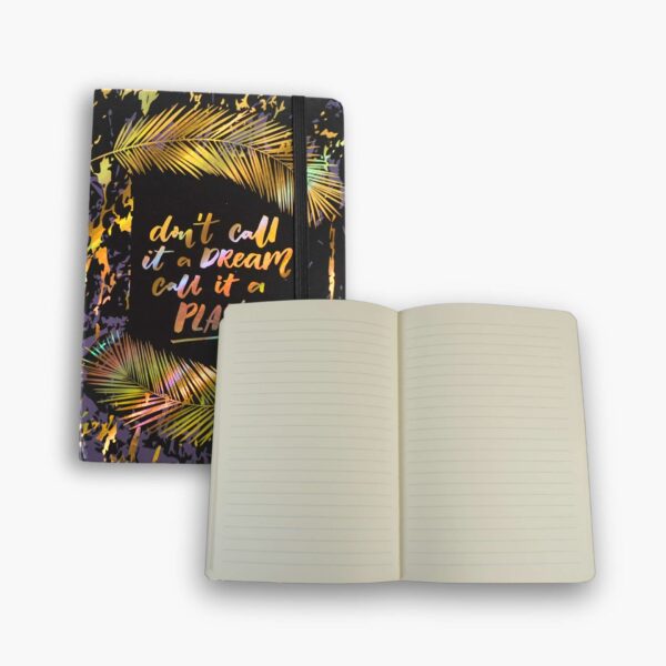 Inside view of black and gold notebook showing lined pages.