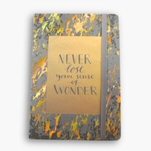 Grey hardcover A5 notebook with gold translucent text: “Never lose your sense of wonder.”