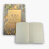 Inside pages of grey and gold notebook with lined layout.