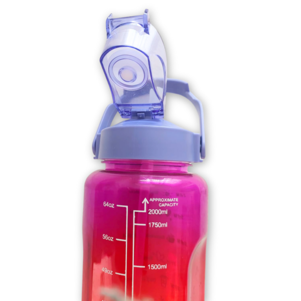 Close-up of ml tracking scale on rainbow gradient bottle