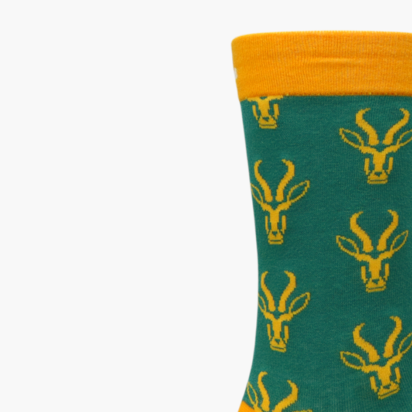 Close-up: Close-up of Bokke sign on green and gold novelty socks
