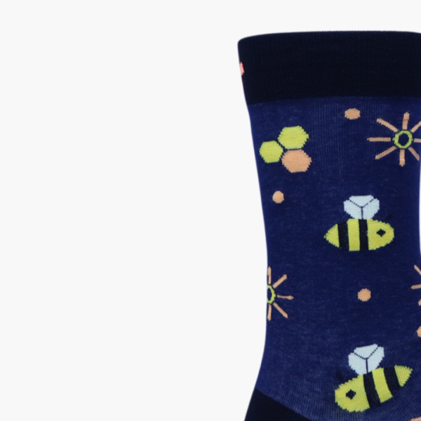 Close-up: Close-up of bee and sparkle pattern on navy socks