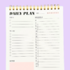 Close-up of pink A5 daily planner top 3 priorities and date sections
