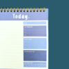 Close-up of blue A5 daily planner top 3 priorities and gratitude