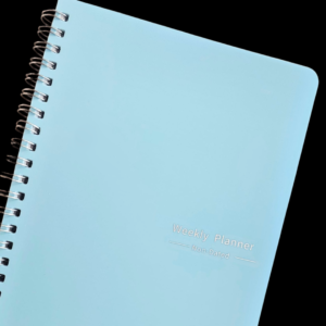 A5 weekly planner book non-dated with weekly focus, goals, to-do list, habit tracker, and day sections